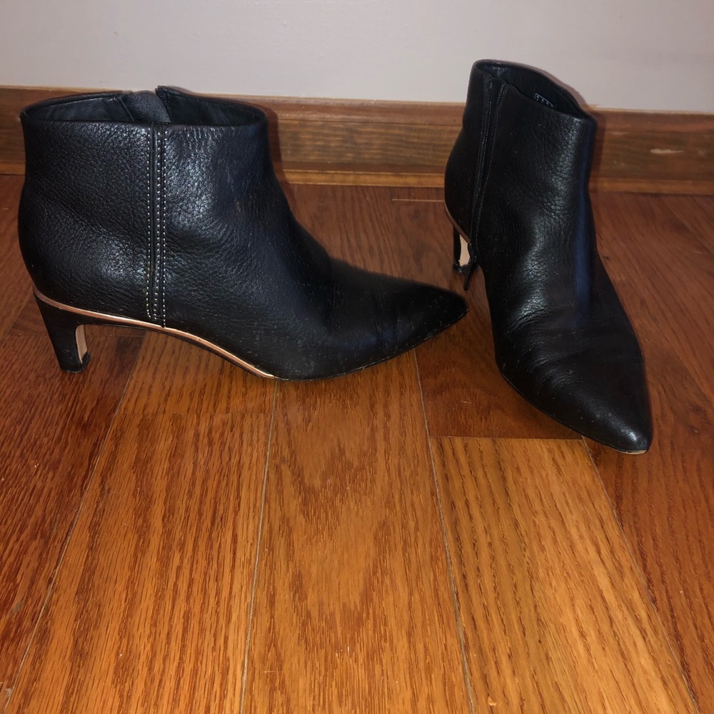 Clark’s booties in black with rose gold trim
